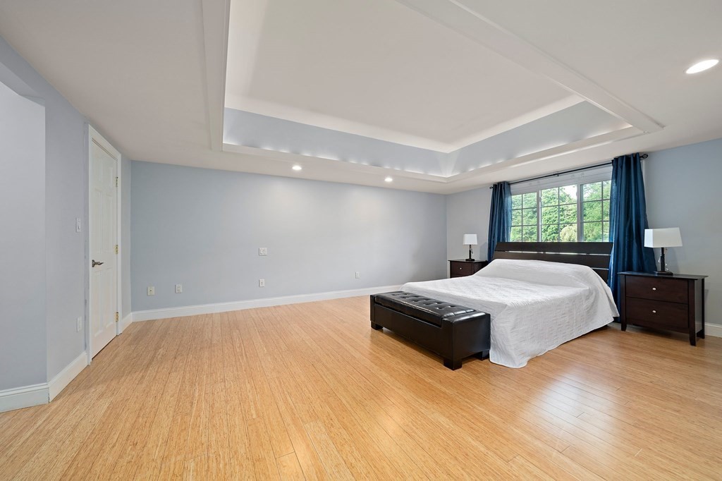 22 Fairview Road Canton, MA 02021 - Photo 23 of 42 a spacious bedroom with a bed and wooden floor