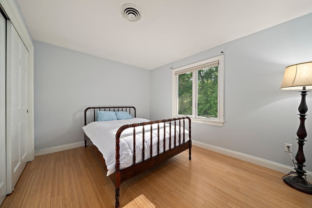 22 Fairview Road Canton, MA 02021 - Photo 29 of 42 a bedroom with a bed and wooden floor