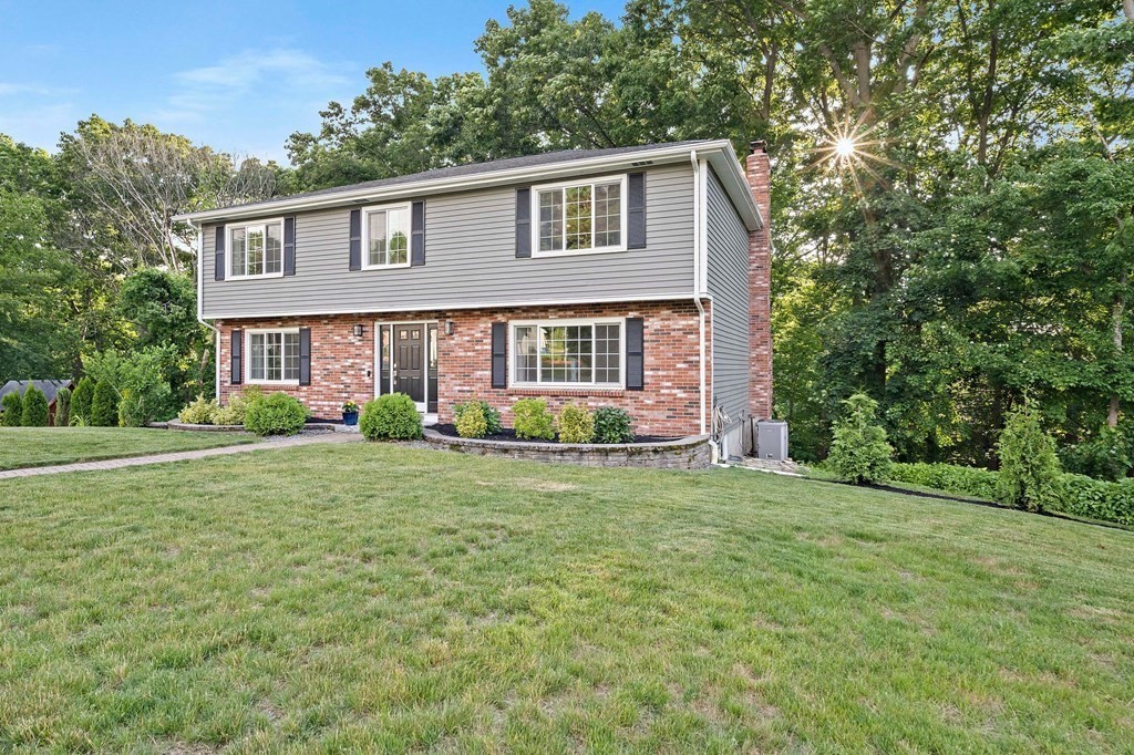 22 Fairview Road Canton, MA 02021 - Photo 3 of 42 a front view of a house with garden