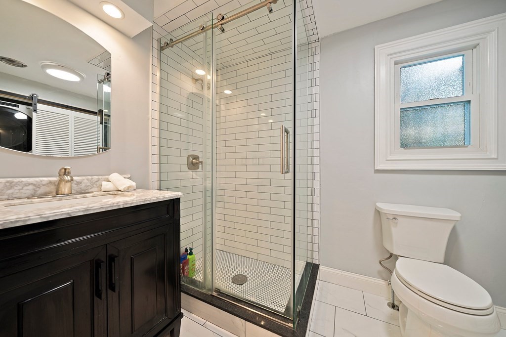 22 Fairview Road Canton, MA 02021 - Photo 31 of 42 a bathroom with a granite countertop sink toilet and shower