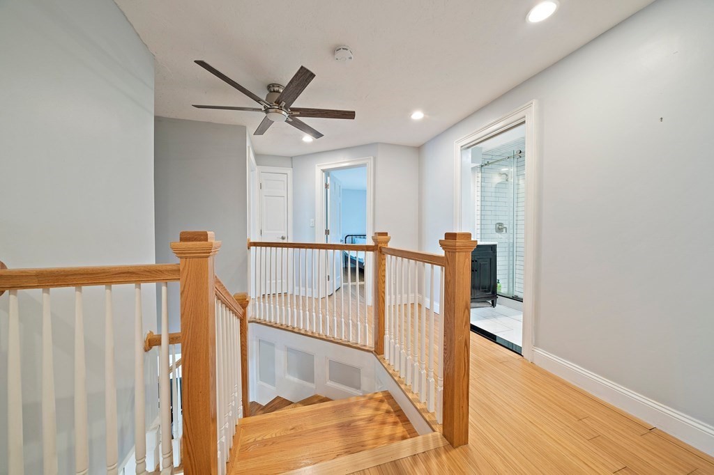 22 Fairview Road Canton, MA 02021 - Photo 33 of 42 a view of a hallway with wooden floor and staircase