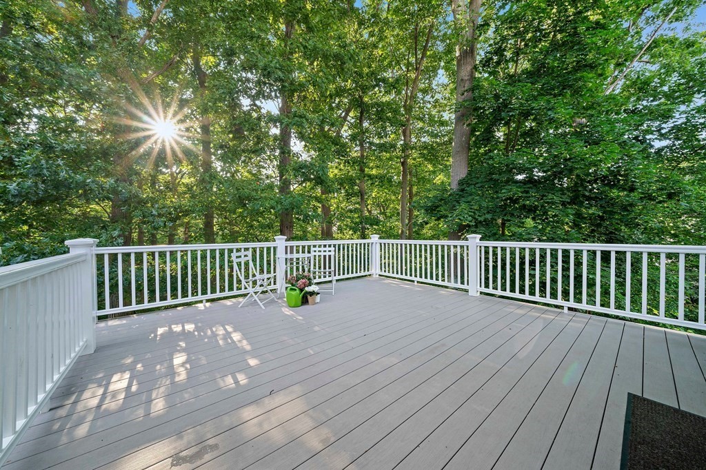 22 Fairview Road Canton, MA 02021 - Photo 36 of 42 a view of a deck with a wooden floor and fence