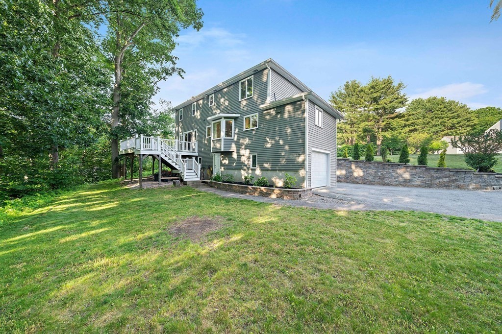 22 Fairview Road Canton, MA 02021 - Photo 38 of 42 a front view of a house with garden