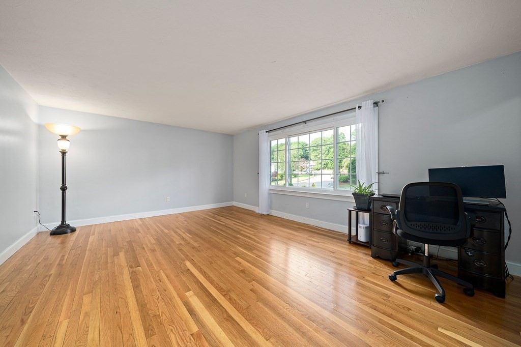 22 Fairview Road Canton, MA 02021 - Photo 8 of 42 a view of a workspace with wooden floor and a window