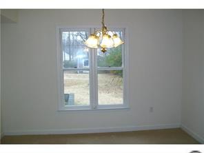 5933 Bluebonnet Road Charlotte, NC 28212 - Photo 6 of 13 a view of a dining room with a chandelier fan