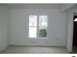 5933 Bluebonnet Road Charlotte, NC 28212 - Photo 7 of 13 a view of an empty room with a window