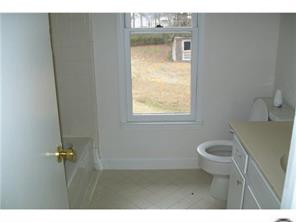 5933 Bluebonnet Road Charlotte, NC 28212 - Photo 8 of 13 a bathroom with a toilet and a sink