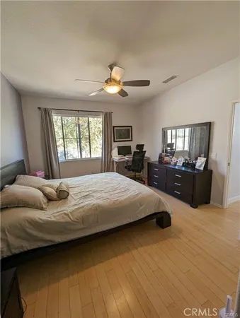 a bedroom with a large bed and furniture