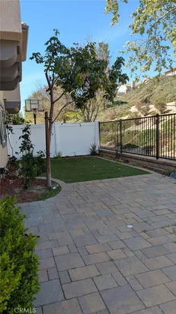 a view of a backyard with a patio