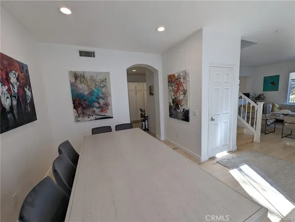 a bedroom with furniture and painting on the wall