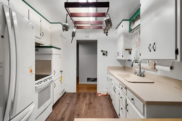 a bathroom with a double vanity sink and mirror