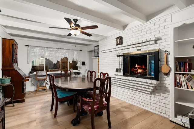 a dining room with furniture and window