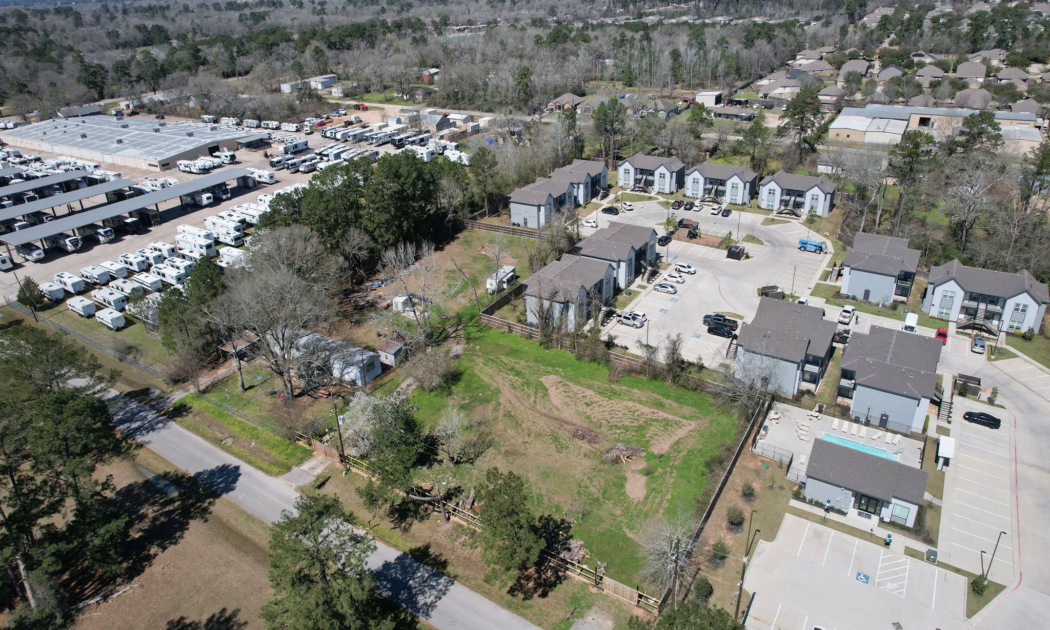 an aerial view of residential houses with outdoor space