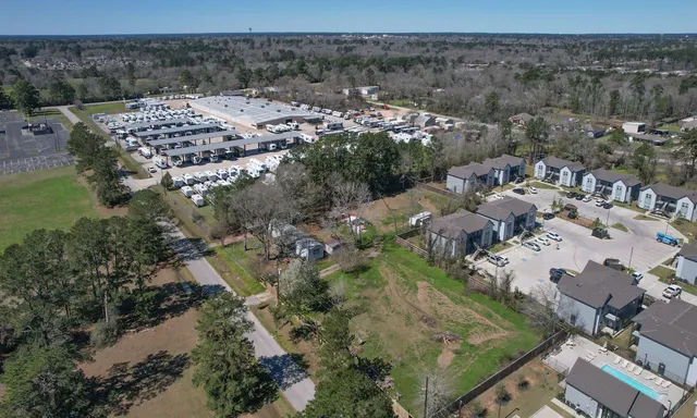 a aerial view of a house with a yard