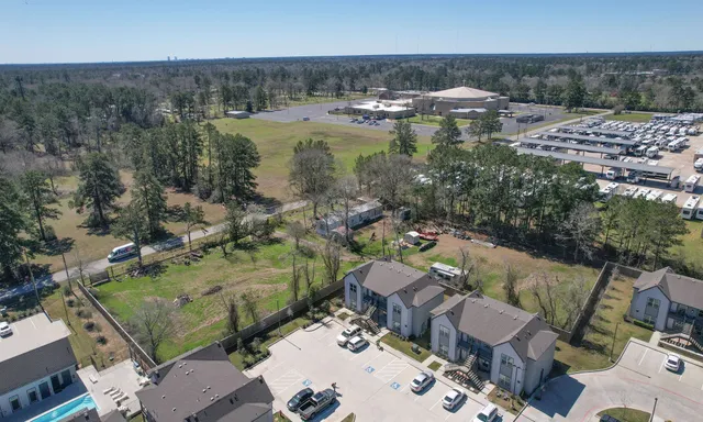 an aerial view of a house with a lake view