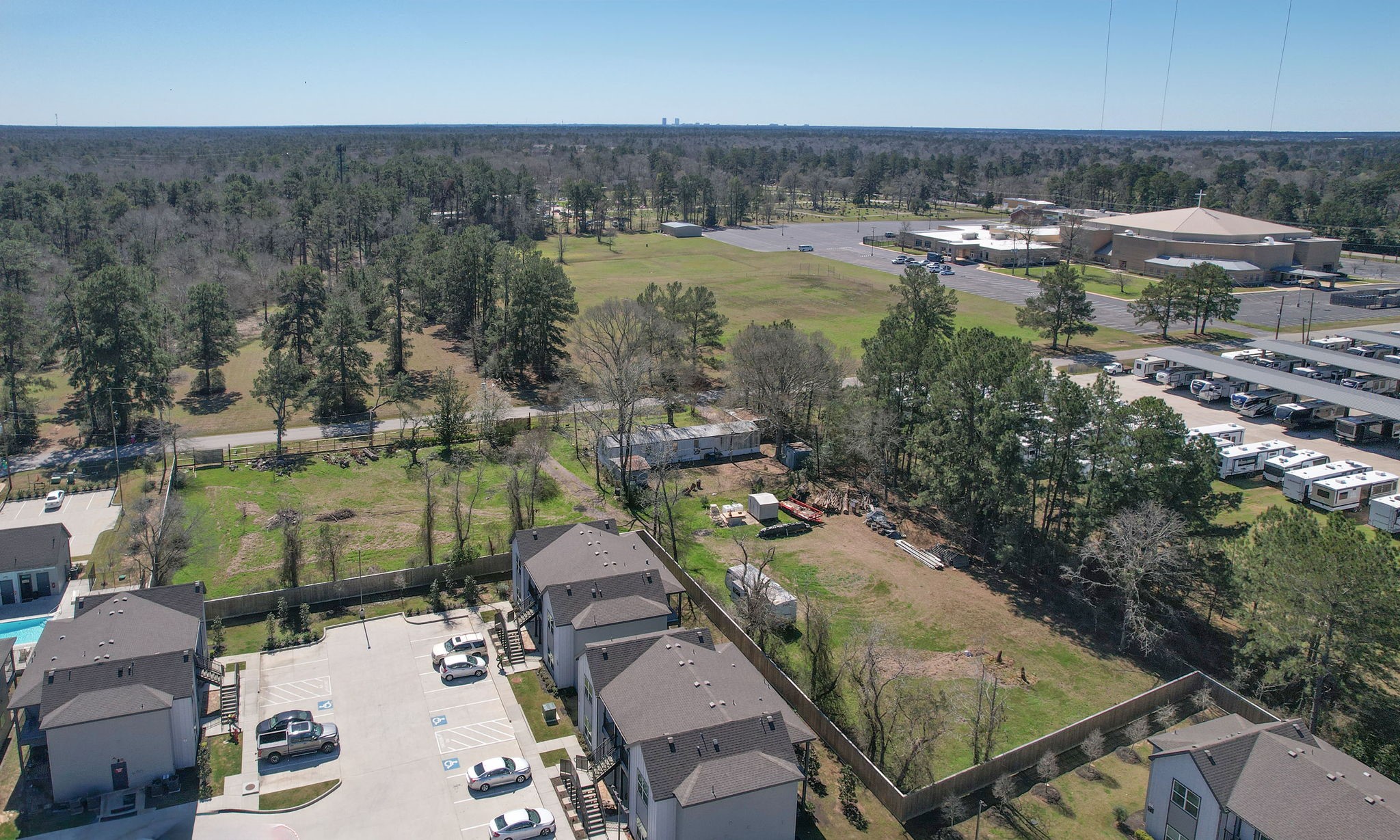1929 Argo Road Conroe, TX 77301 - Photo 19 of 24 an aerial view of residential houses with outdoor space and lake view