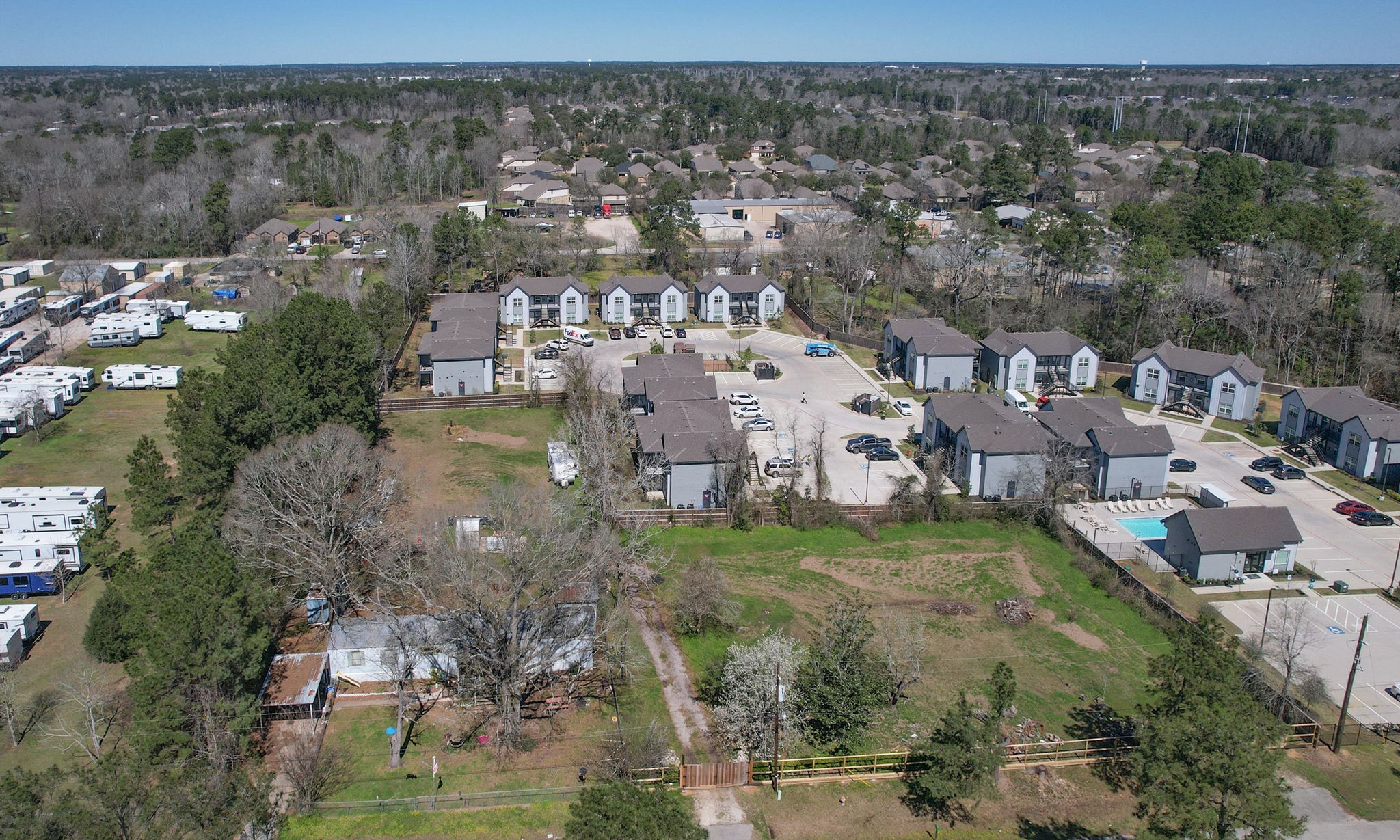 1929 Argo Road Conroe, TX 77301 - Photo 23 of 24 an aerial view of residential houses with outdoor space and trees