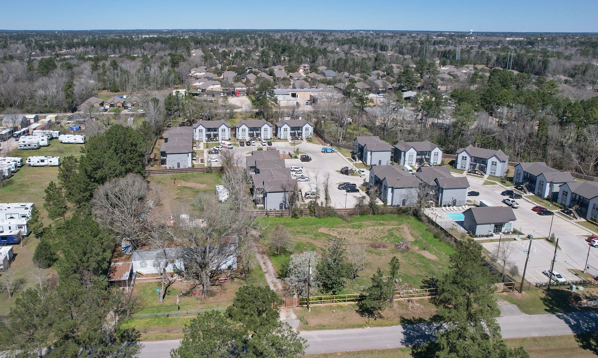 1929 Argo Road Conroe, TX 77301 - Photo 24 of 24 an aerial view of residential houses with outdoor space and trees