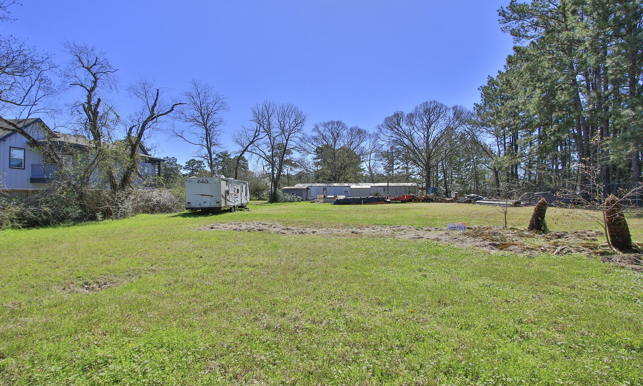 1929 Argo Road Conroe, TX 77301 - Photo 7 of 24 a view of yard with tree and green space