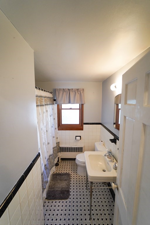 16 Coolidge Road Milton, MA 02186 - Photo 21 of 24 a bathroom with a sink a toilet and a shower