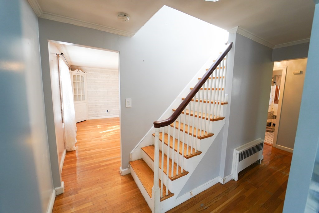 16 Coolidge Road Milton, MA 02186 - Photo 23 of 24 a view of an entryway with wooden floor