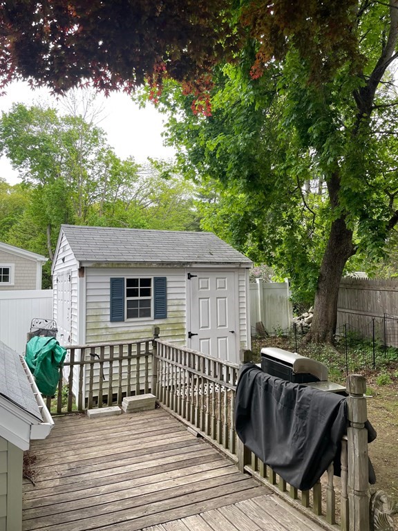 16 Coolidge Road Milton, MA 02186 - Photo 3 of 24 a view of backyard with deck and outdoor seating