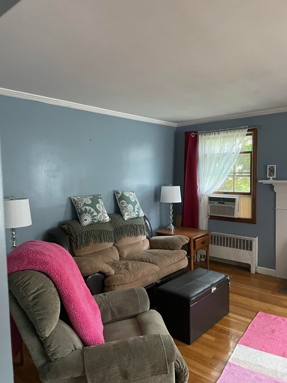 16 Coolidge Road Milton, MA 02186 - Photo 4 of 24 a bedroom with a bed and a couch