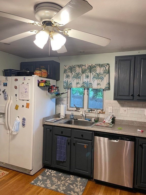 16 Coolidge Road Milton, MA 02186 - Photo 6 of 24 a kitchen with stainless steel appliances granite countertop a sink and cabinets