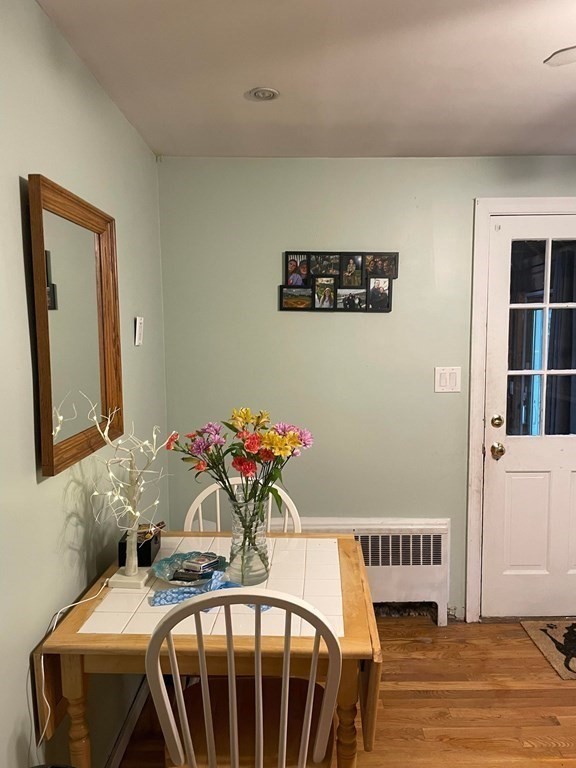 16 Coolidge Road Milton, MA 02186 - Photo 7 of 24 a view of a dining room with furniture and wooden floor