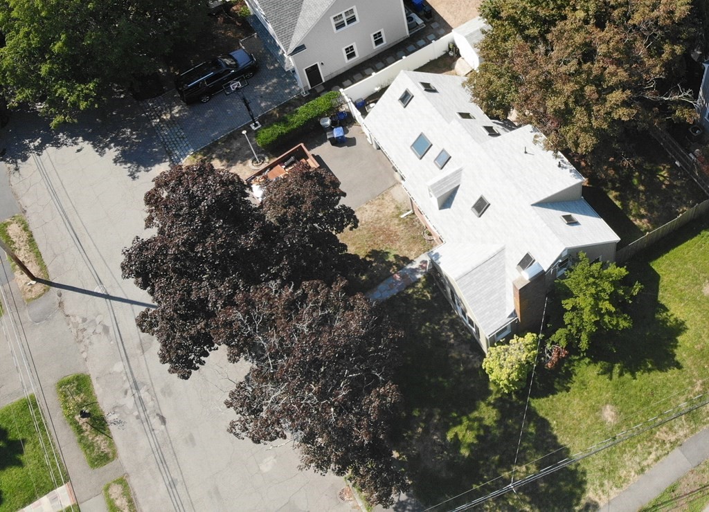 16 Coolidge Road Milton, MA 02186 - Photo 9 of 24 an aerial view of a house with a yard