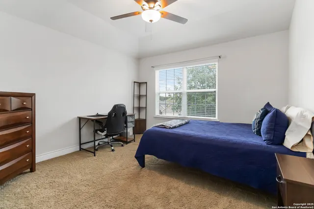 a bed room with a bed and a window