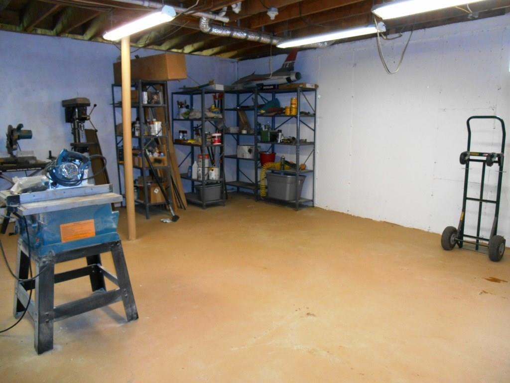 1356 Stratton Road Rangeley, ME 04970 - Photo 33 of 35 One of 2 workshop spaces in the basement