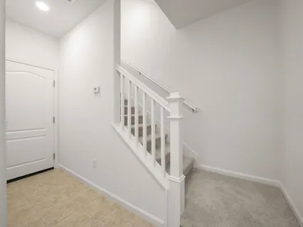 a view of a hallway with staircase