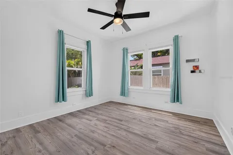 a view of livingroom with hardwood floor and a ceiling fan
