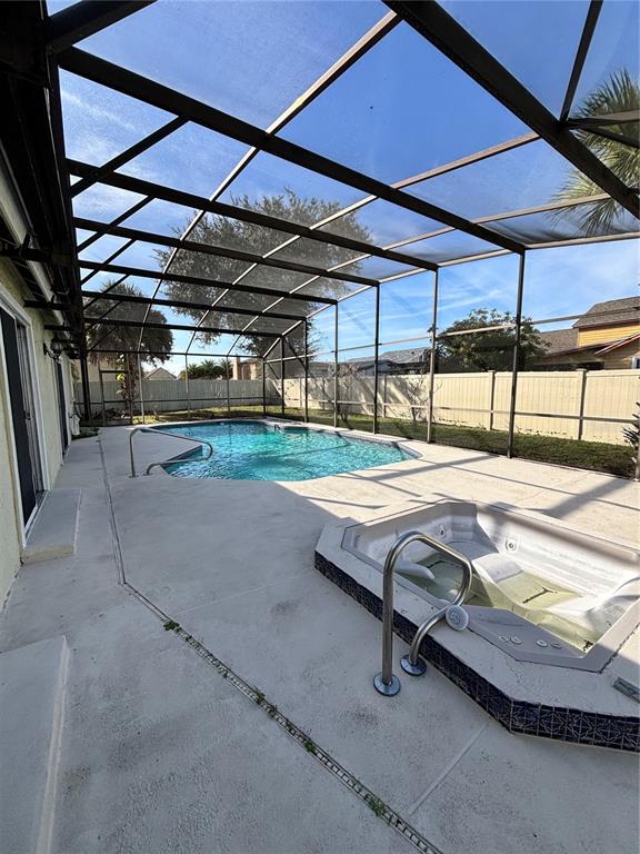 2346 St Croix Street Kissimmee, FL 34741 - Photo 12 of 12 a swimming pool with a outdoor seating