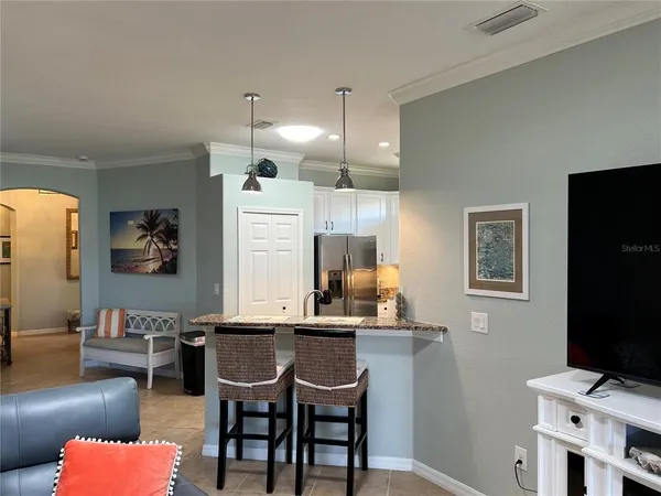 a view of a dining room with furniture and window