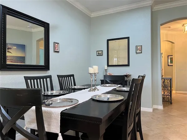 a view of a hallway with workspace and a window