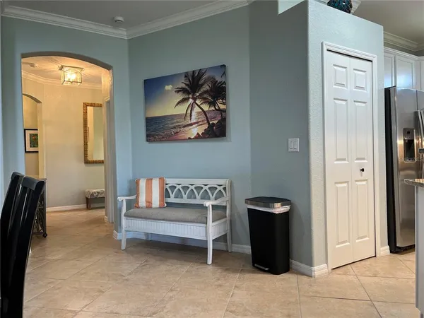 a bedroom with a bed and a dresser next to a window
