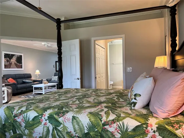 a bedroom with a bed dresser and a window