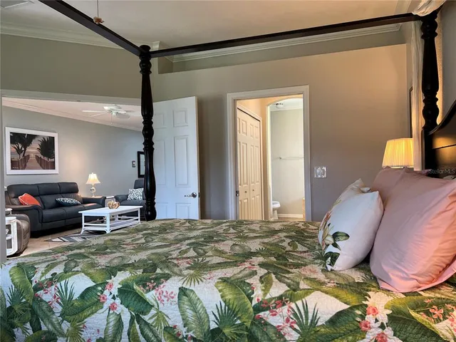 a bedroom with a bed dresser and a window