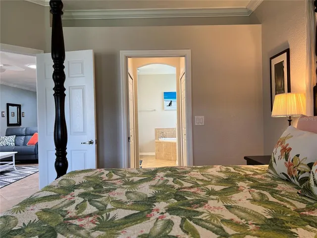 a bathroom with a sink a toilet and a large mirror