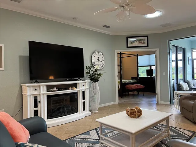 a living room with furniture and a lamp