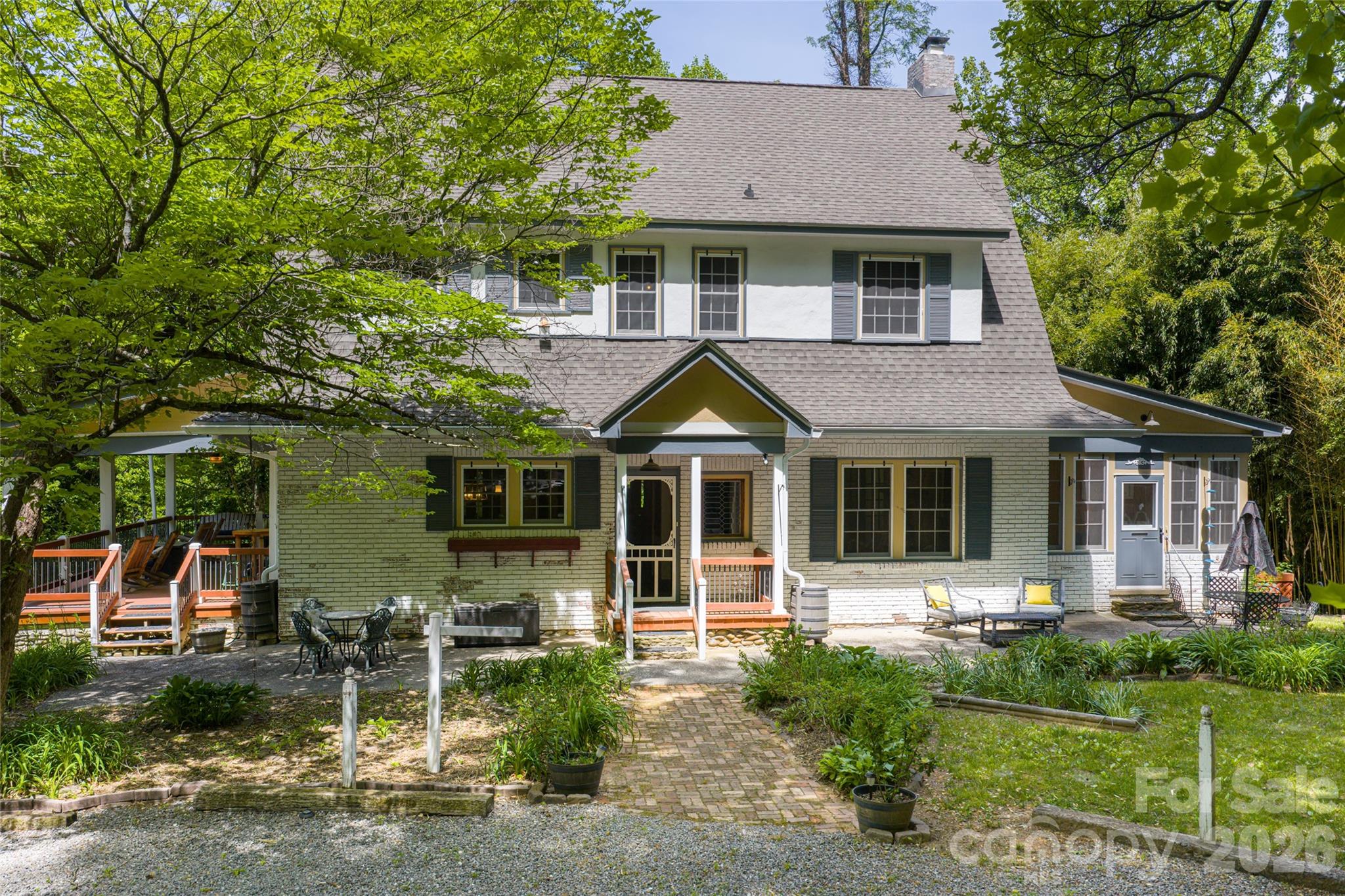 147 Preservation Way Waynesville, NC 28786 - Photo 1 of 48 a front view of a house with a yard garage and outdoor seating
