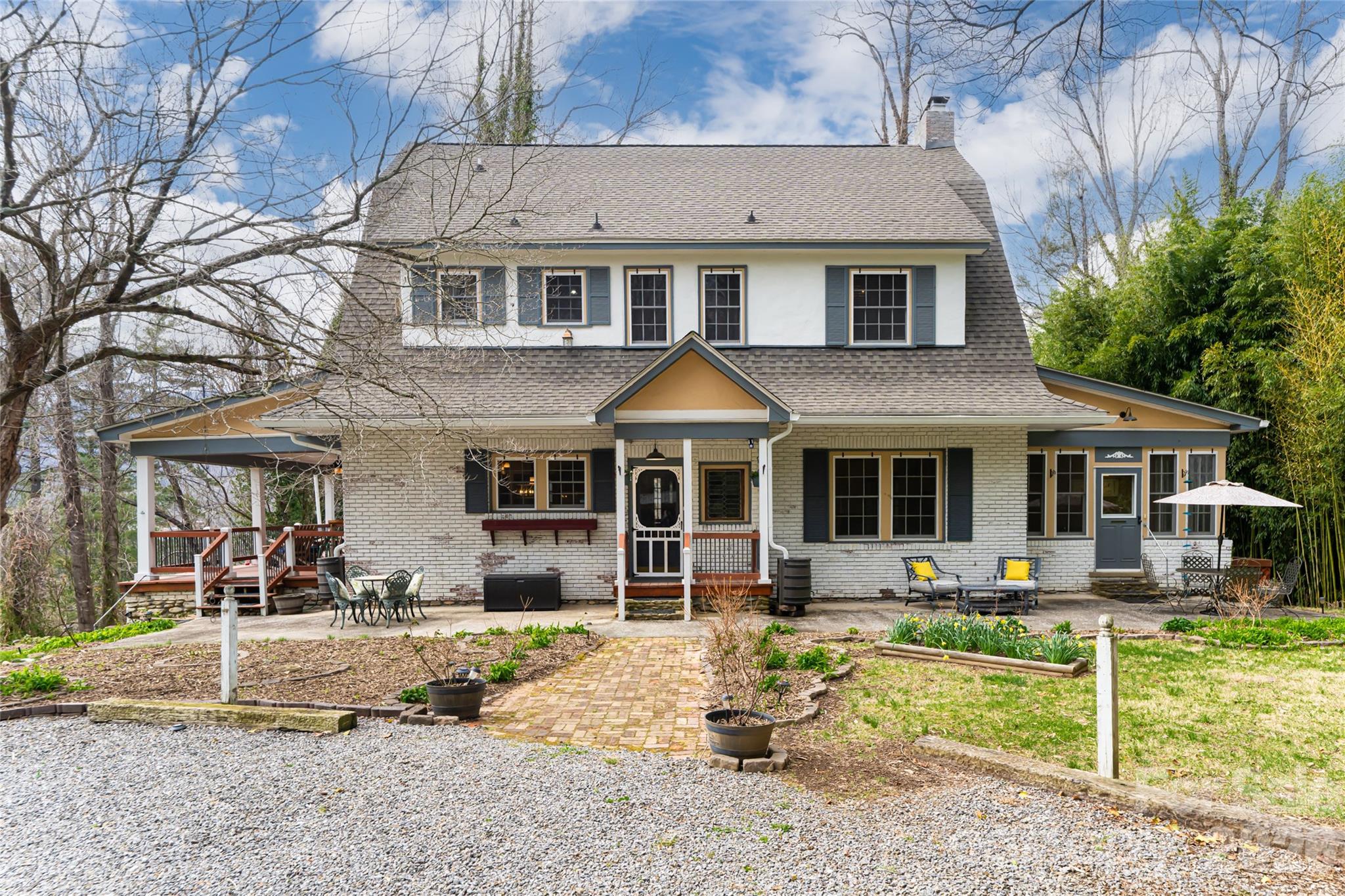 a front view of a house with a yard patio and fire pit