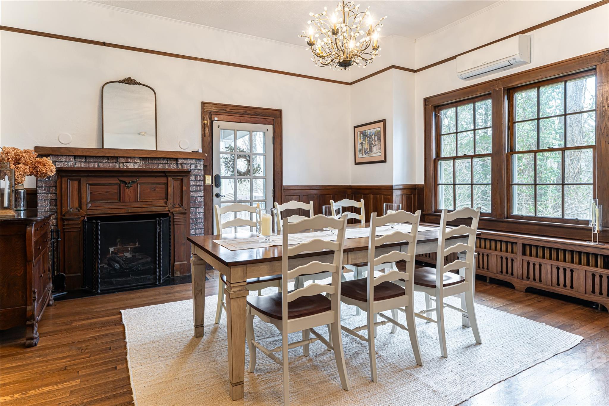 147 Preservation Way Waynesville, NC 28786 - Photo 16 of 48 a dining room with furniture a fireplace and wooden floor