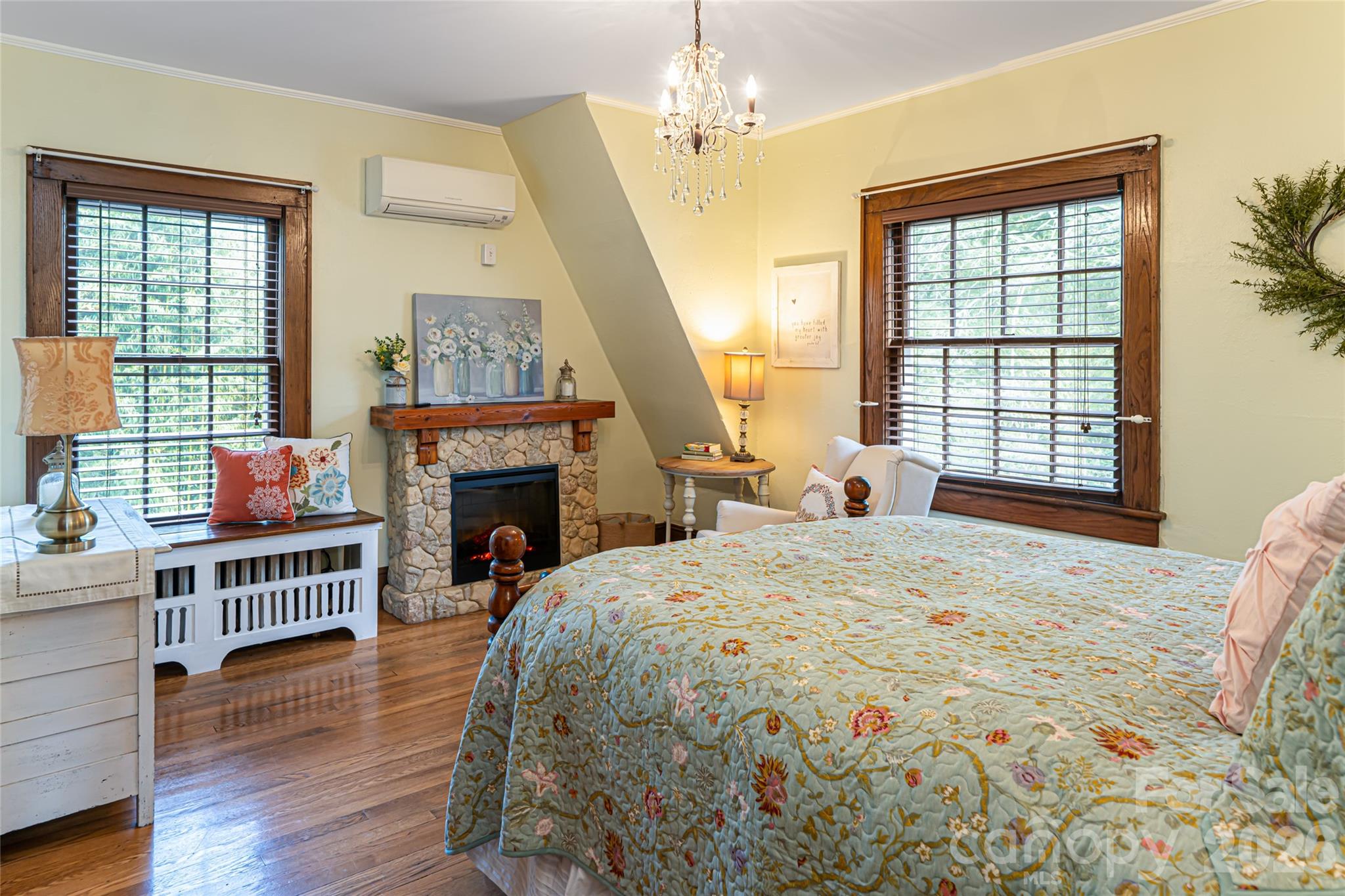 147 Preservation Way Waynesville, NC 28786 - Photo 31 of 48 a bedroom with a bed and a fireplace