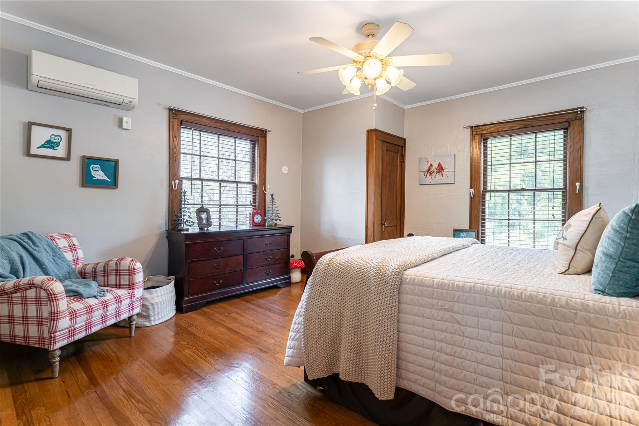 147 Preservation Way Waynesville, NC 28786 - Photo 34 of 48 a bedroom with a bed and wooden floor