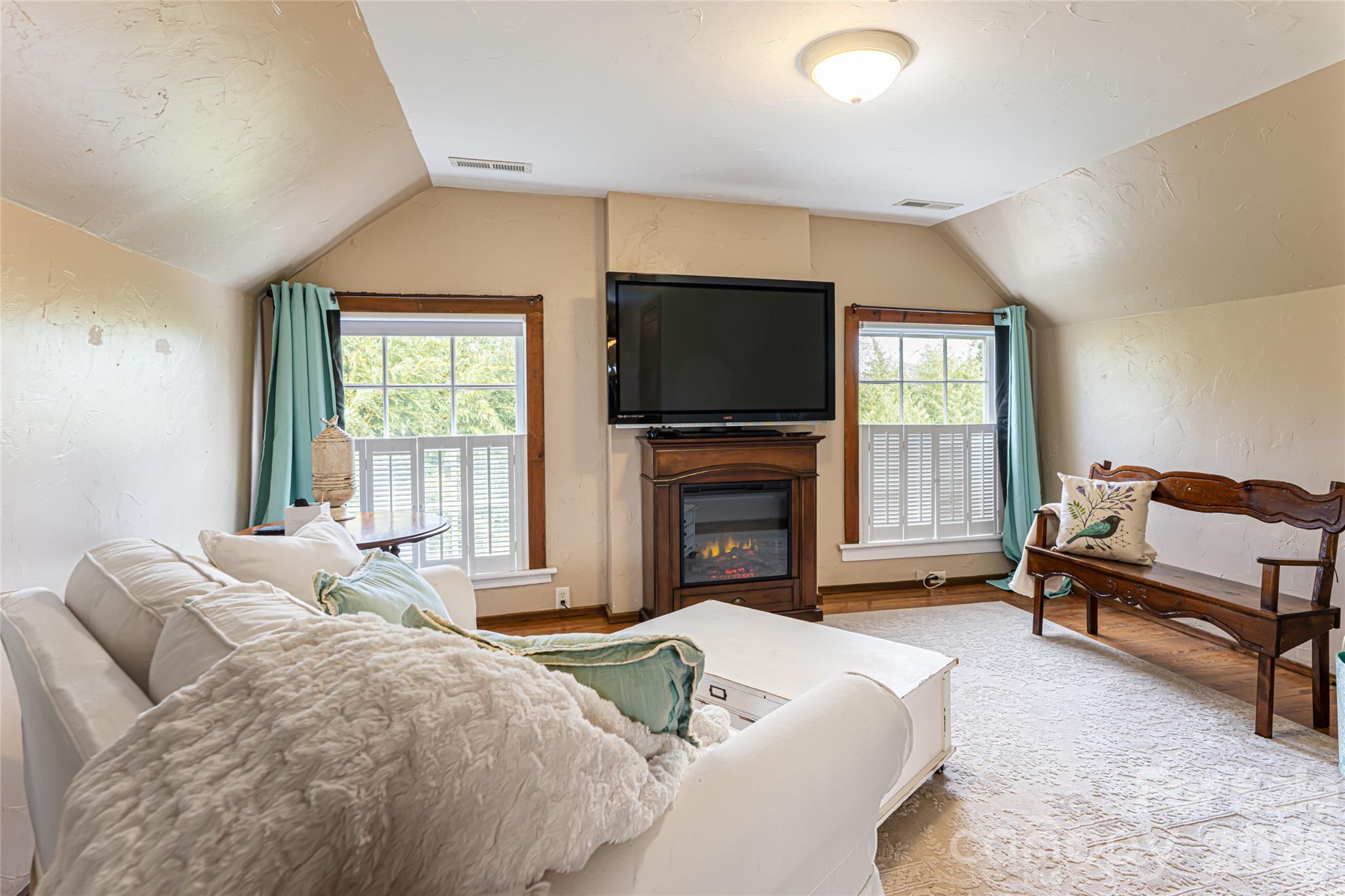 147 Preservation Way Waynesville, NC 28786 - Photo 35 of 48 a spacious bedroom with a bed and a flat screen tv