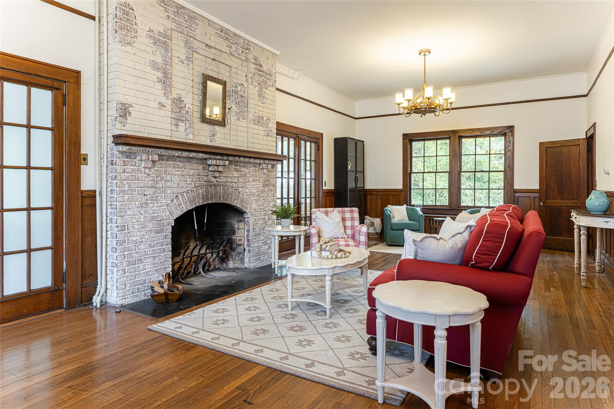 147 Preservation Way Waynesville, NC 28786 - Photo 4 of 48 a living room with furniture a fireplace and a flat screen tv