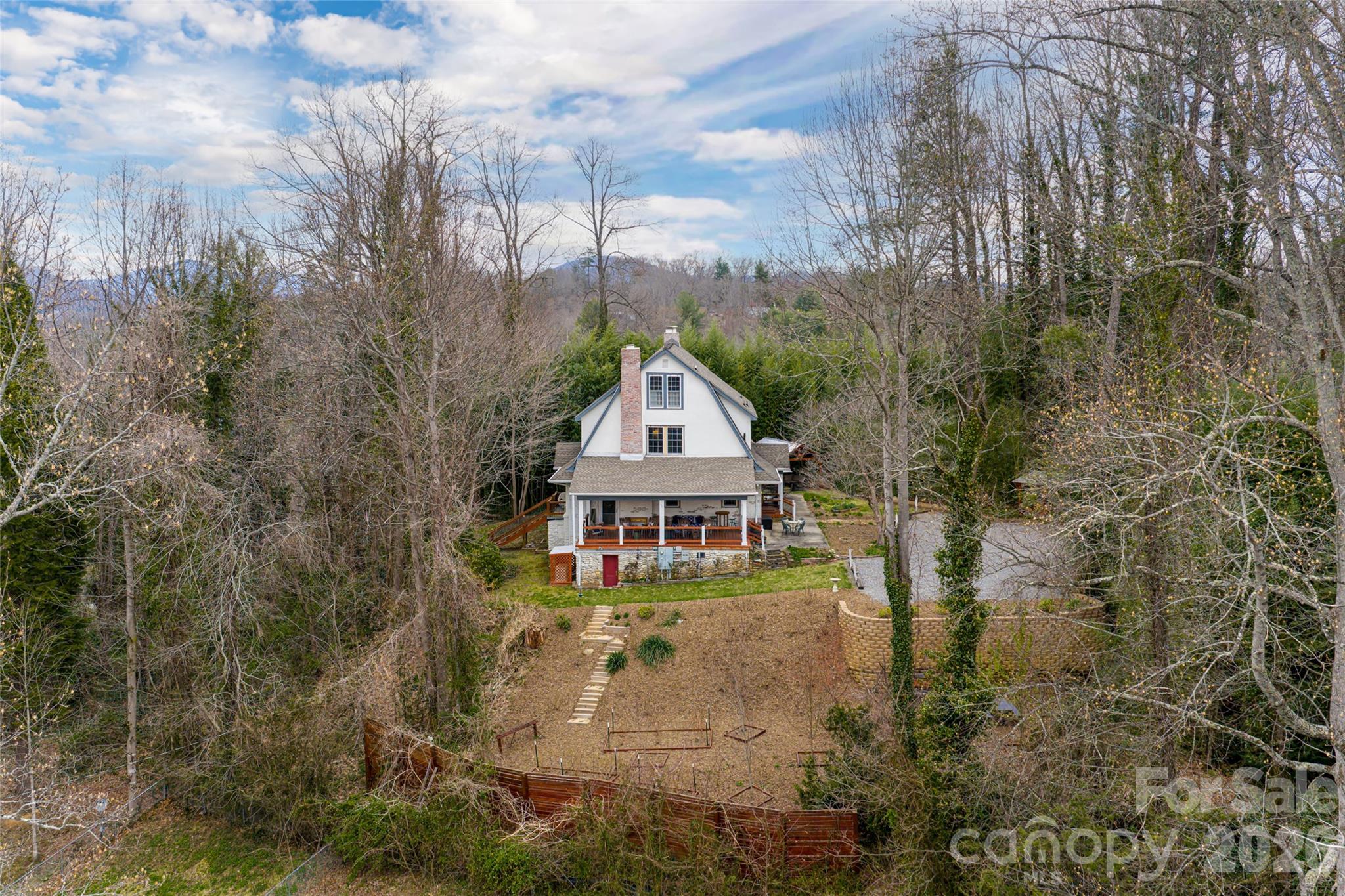 147 Preservation Way Waynesville, NC 28786 - Photo 45 of 48 a view of a house with a small yard and large trees